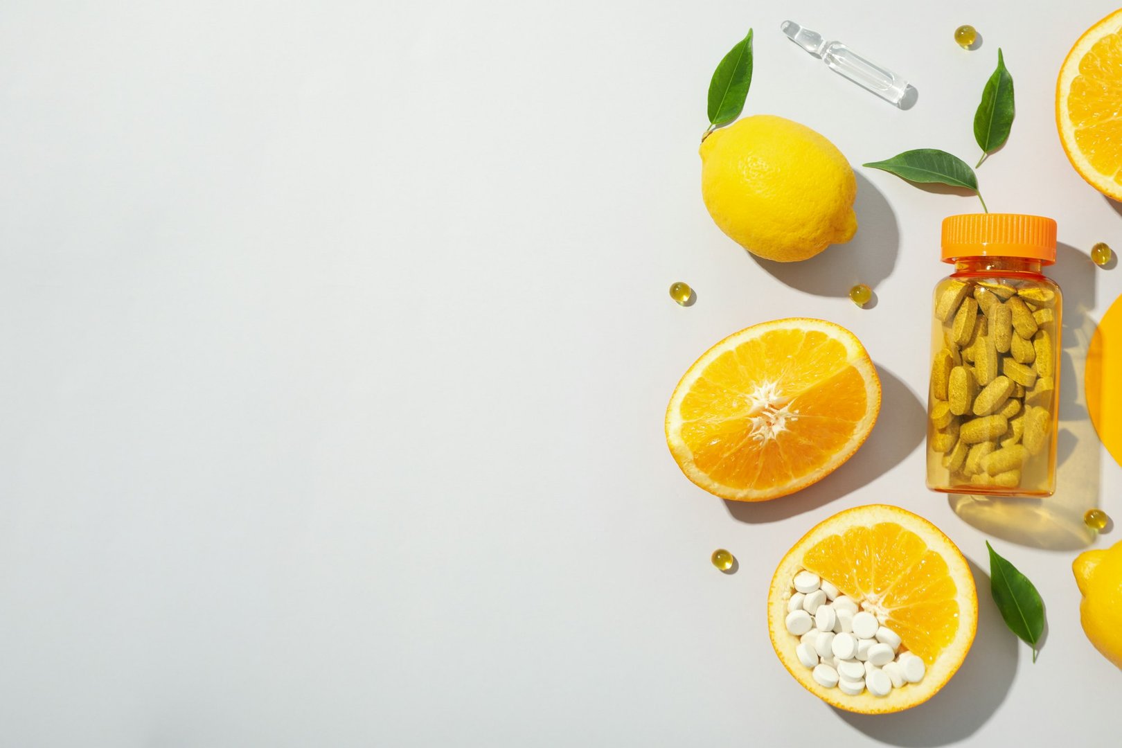 Bio-supplement vitamin C, in tablets on a light background.