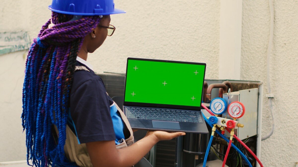 HVAC wireman on chroma key laptop