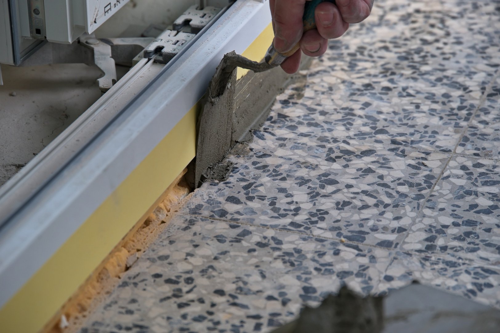 Hand builder leveling concrete