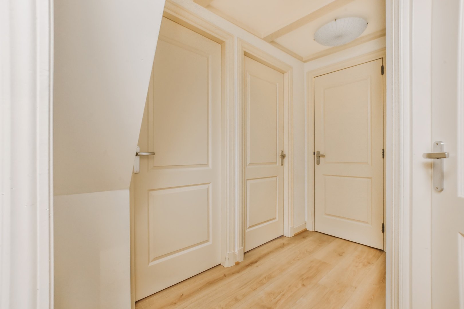 Corridor with three doors