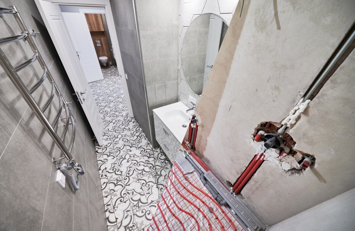 Bathroom with heated floor before and after renovation.