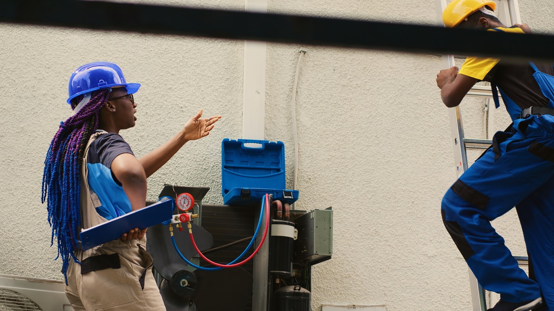 Diverse team checking HVAC system
