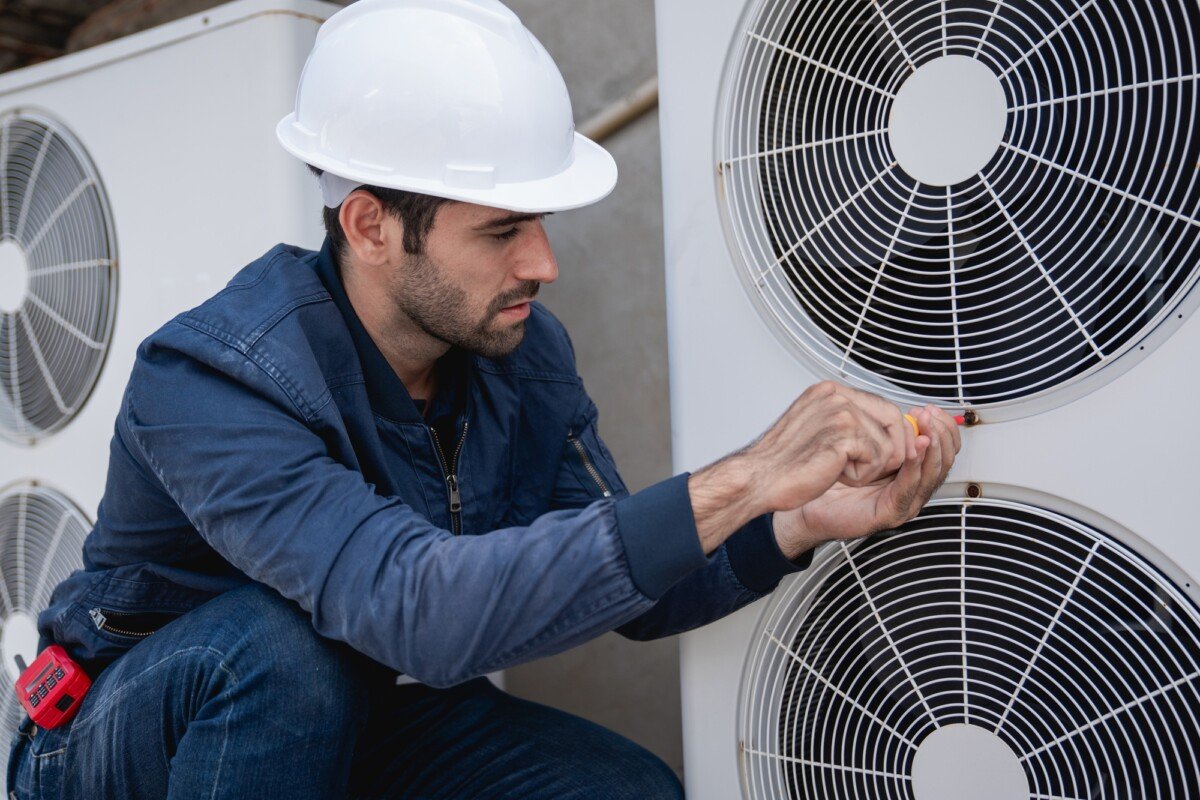 Engineers checking air conditioning cooling system of a major building or industrial facility.