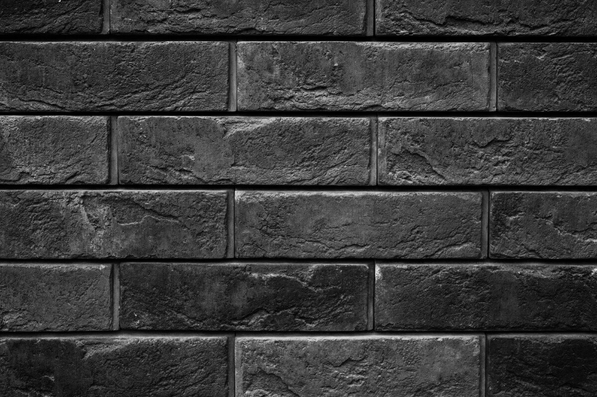 pattern of decorative dark black slate stone wall surface as a background