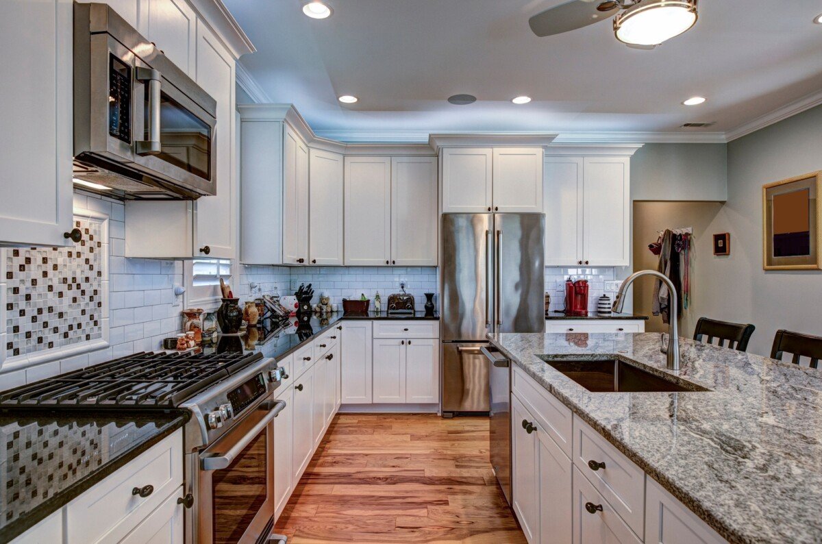 High-end luxury kitchen with granite countertops and white cabin