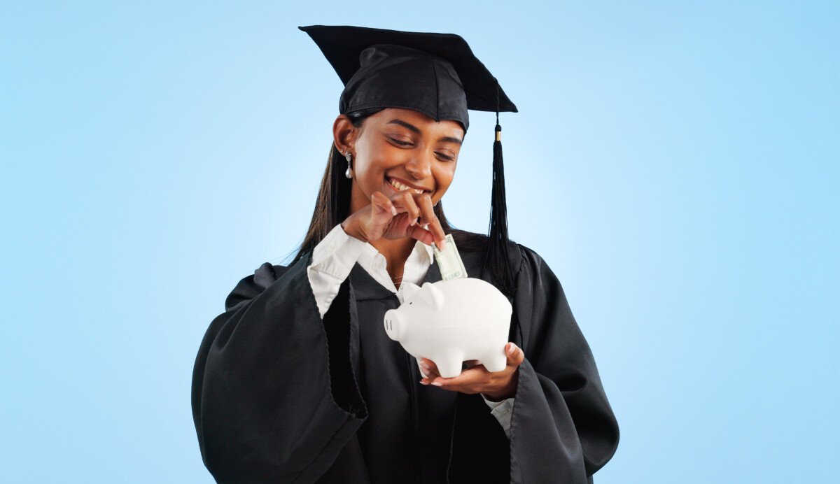 Woman, graduation and piggy bank in studio, saving and cash for investing, future or goals by blue .