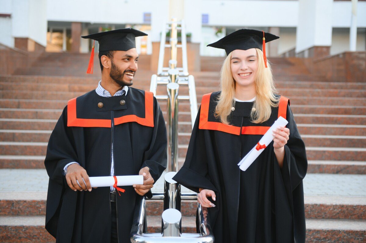 education, graduation and people concept – group of happy international students