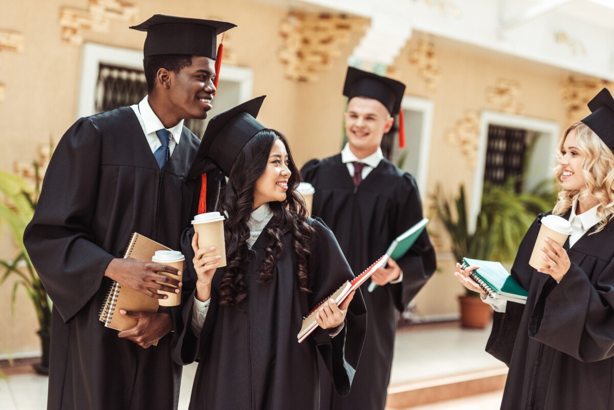 group of graduated multiethnic students spending time together