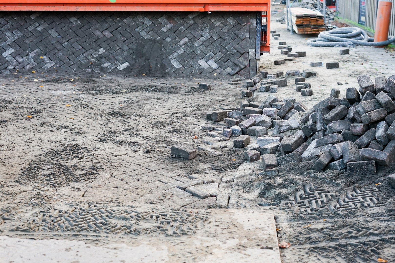 Street renovation. Heavy paving machine for paving stones on the street makes it easy for workers.