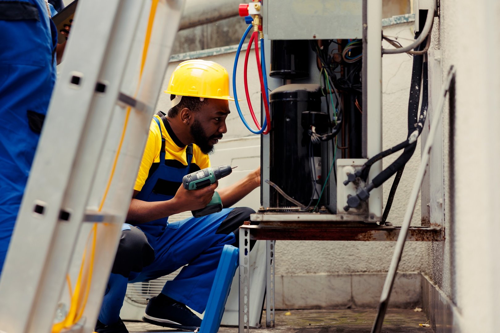 Electricians repairing hvac system