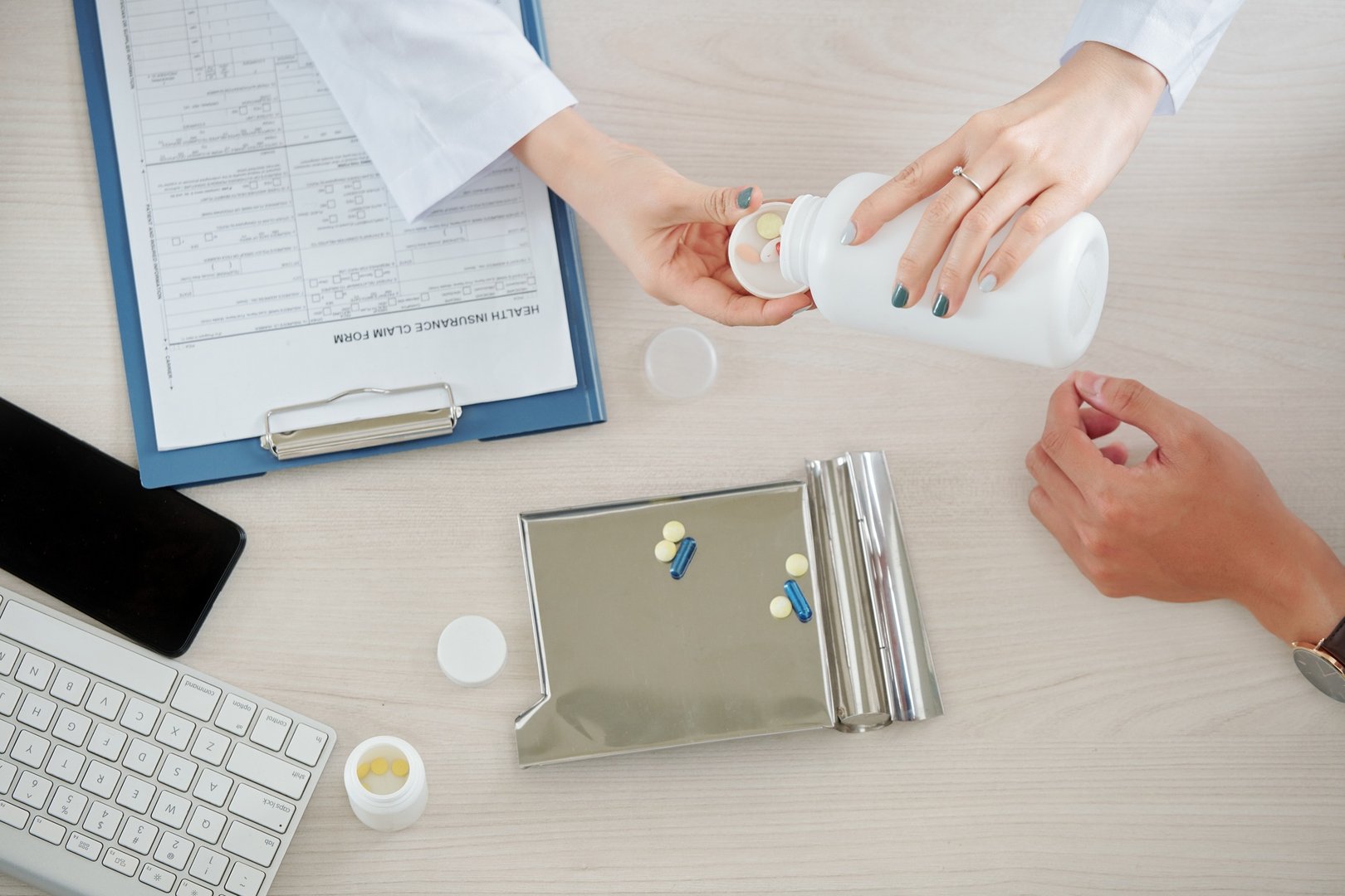 Doctor giving patient supplements