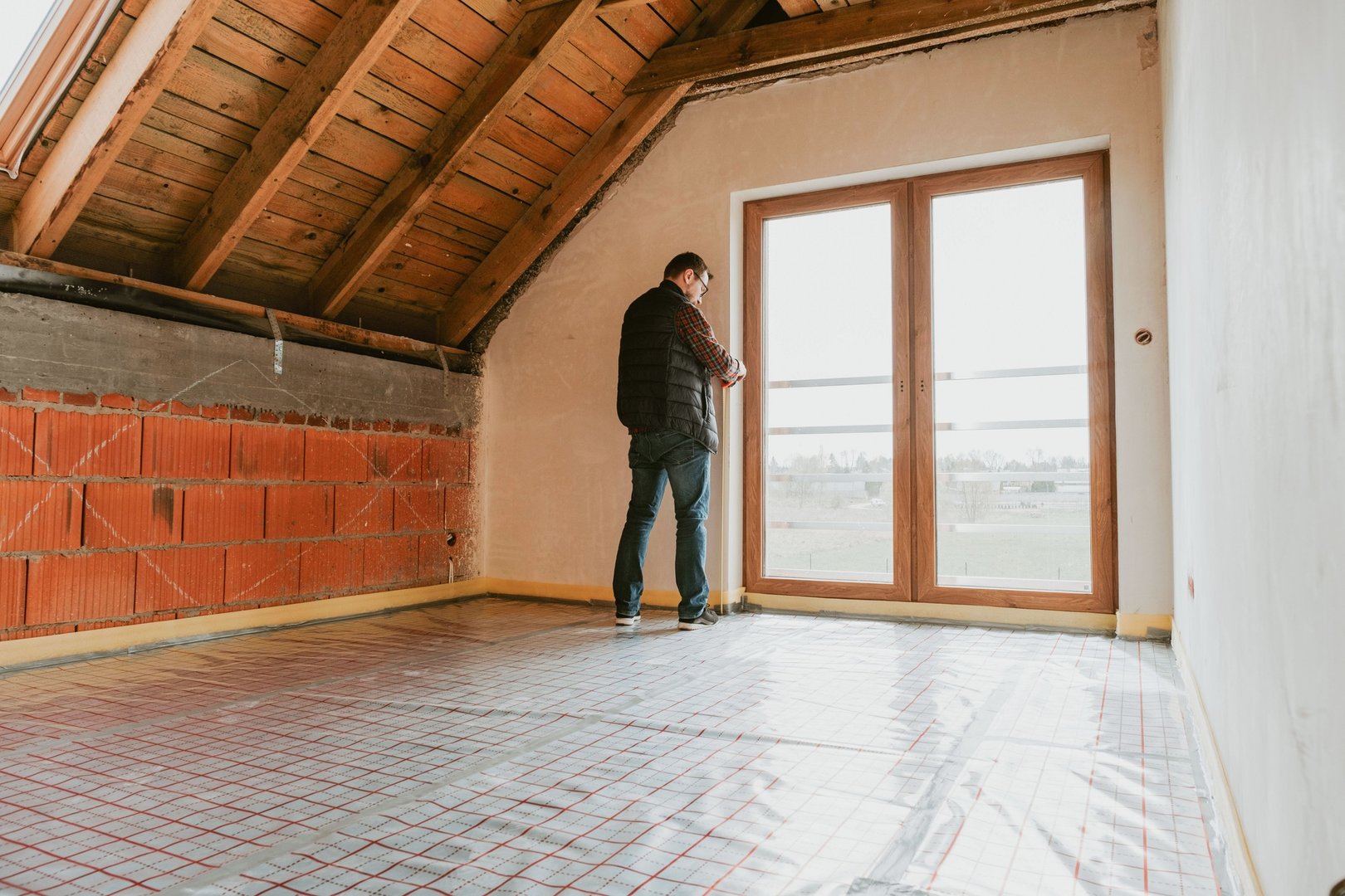 Men inside new house, construction site
