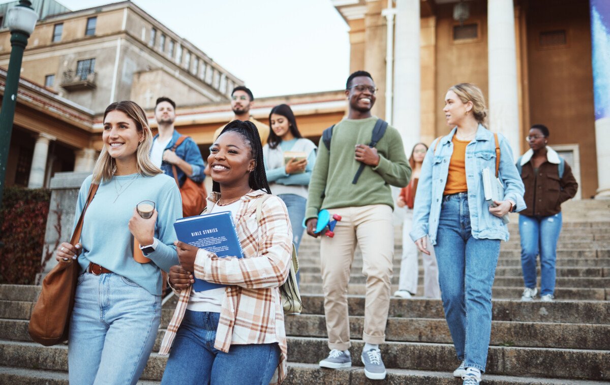 Diversity, students and walking on university steps, school stairs or college campus to morning cla.