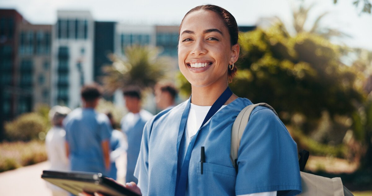 Happy woman, portrait and nurse with tablet for internship, med school or healthcare campaign at ca.