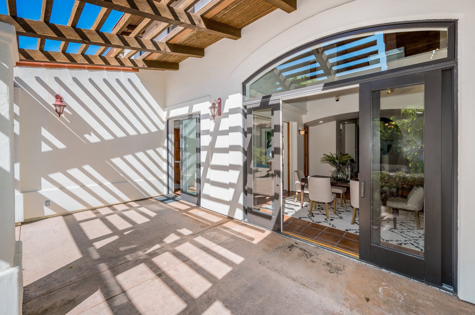 the patio has many patio accessories and doors to open up it