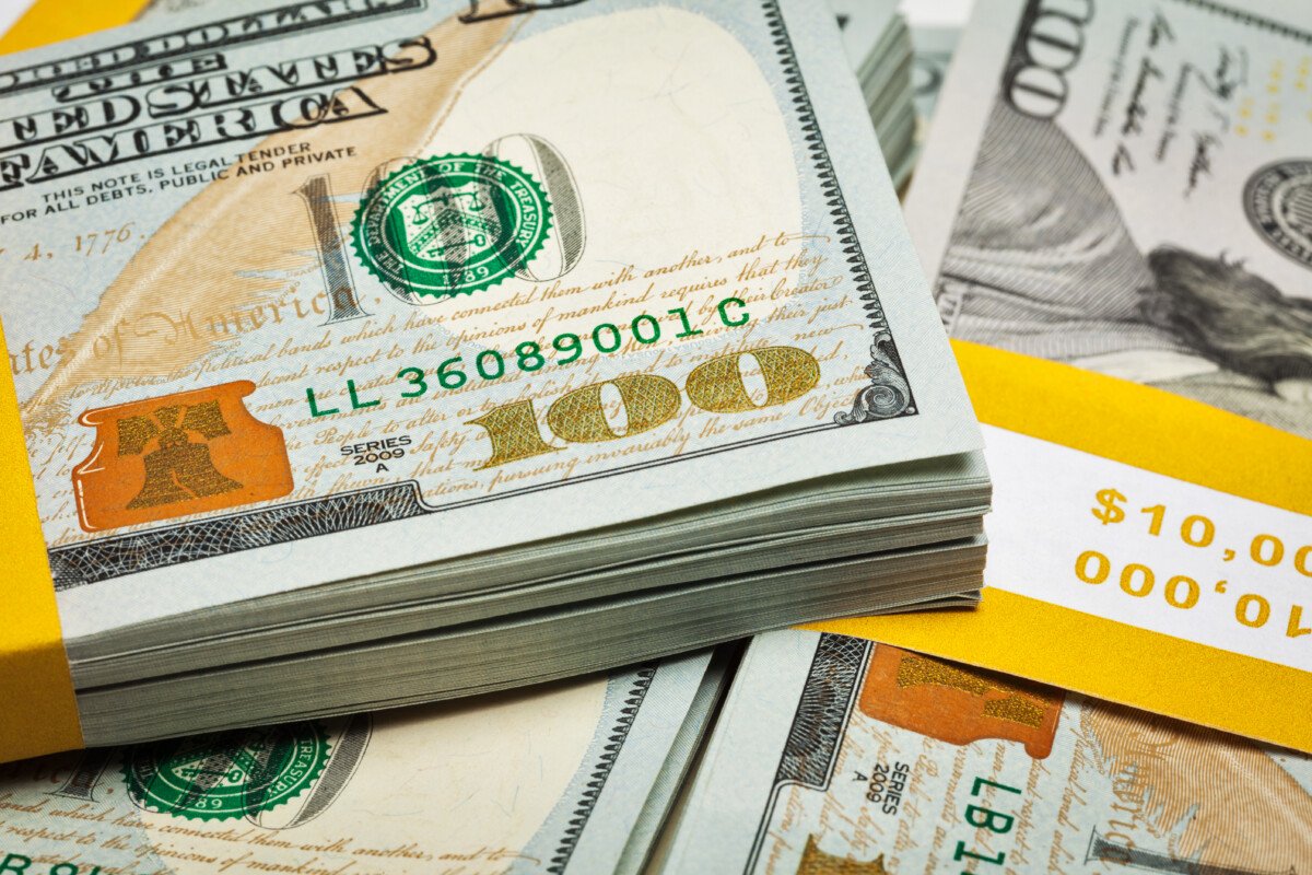 Creative business finance making money concept – background of of new 100 US dollars 2013 edition banknotes bills…