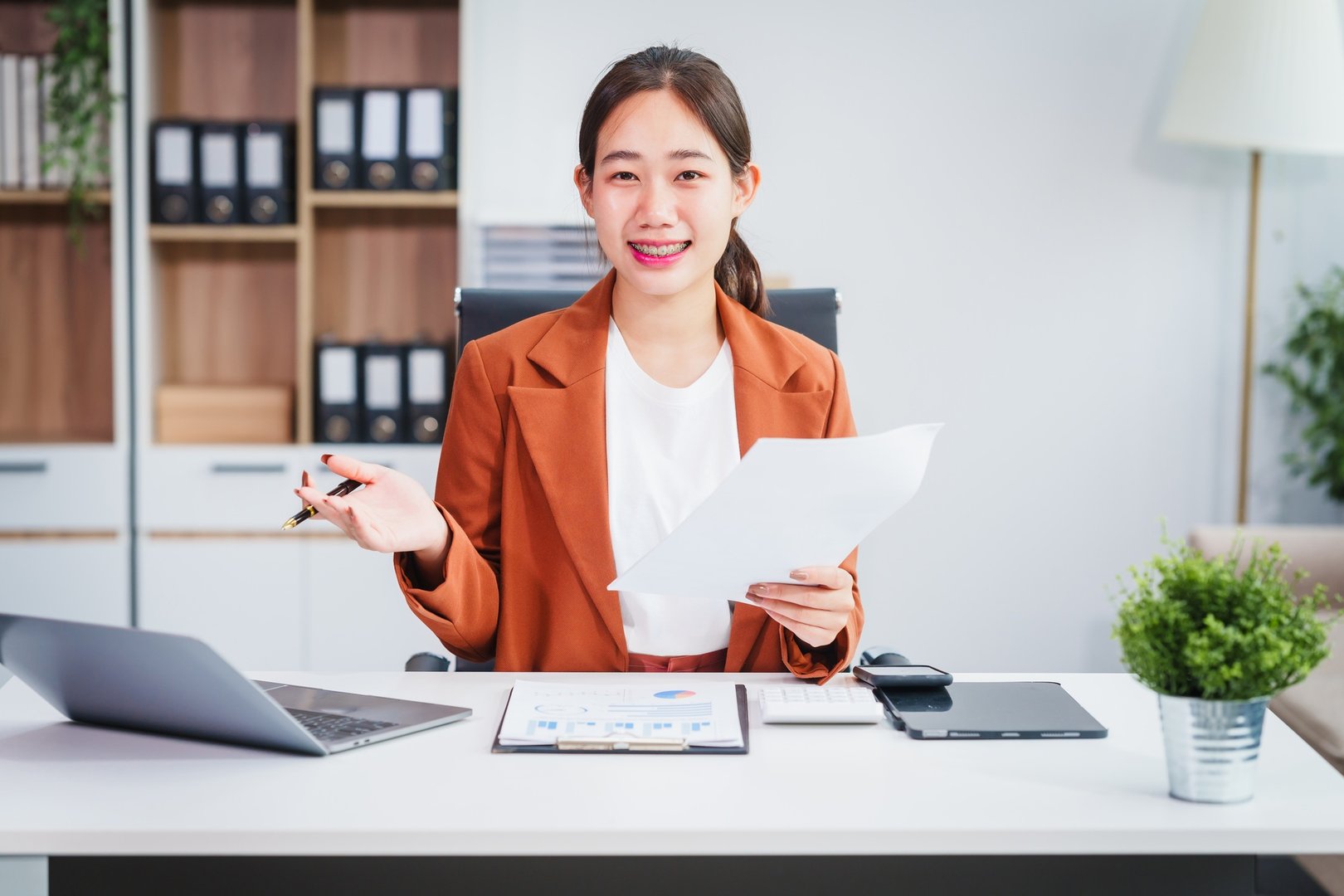 Asian businesswoman specializing in stock market financial services, including roles loan officer