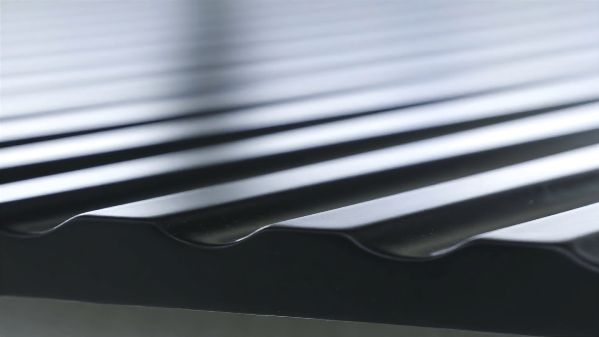 Close up view of black roofing waterproof material, construction and building concept. Action. The