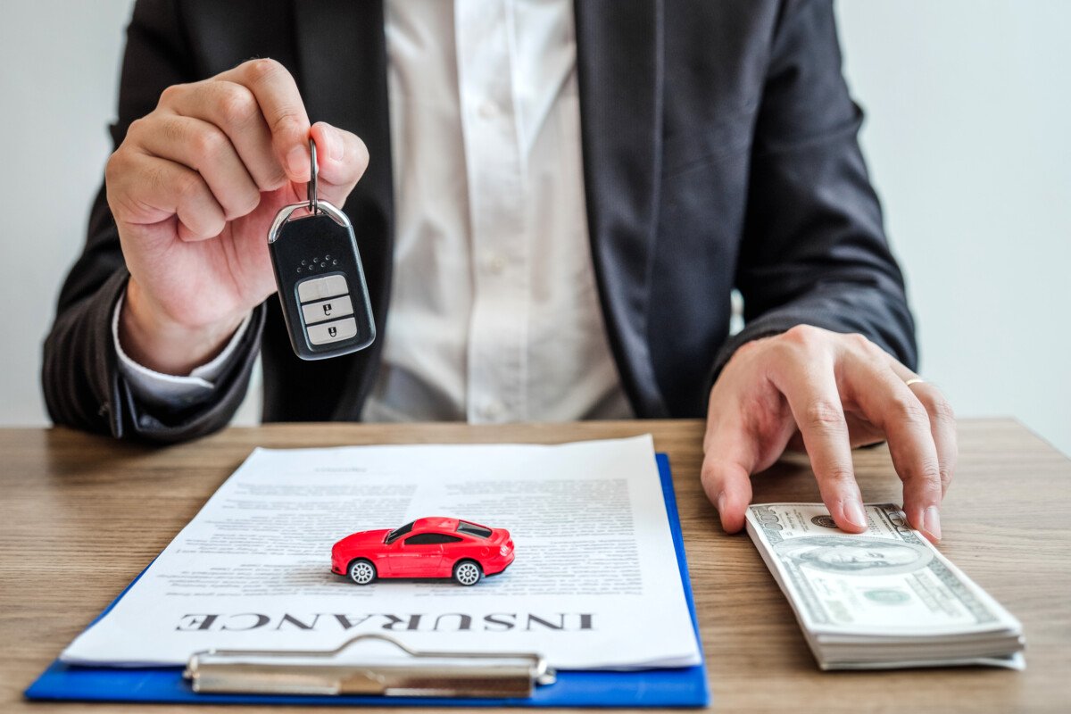 Sale agent deal to agreement successful car loan contract with customer and sign agreement contract Insurance car concept.