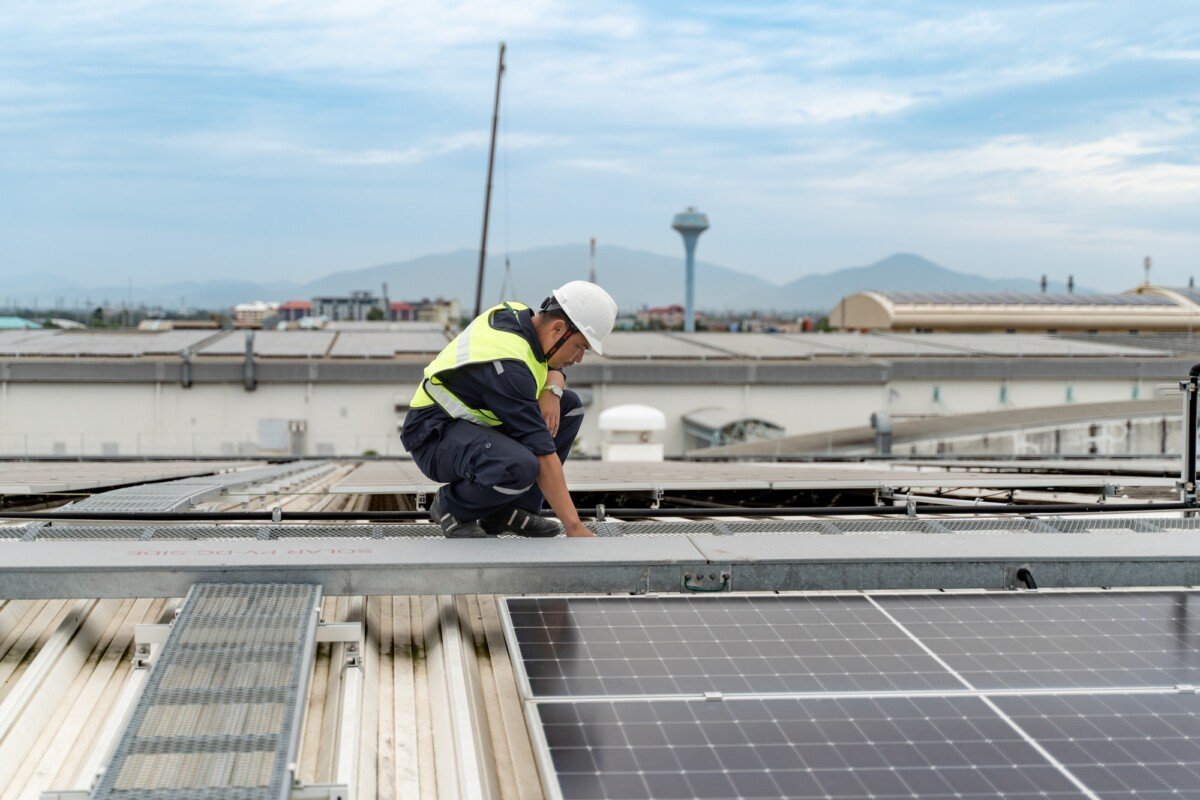 Technology solar cell, Engineers walking on roof inspect and check solar cell panel, service check i