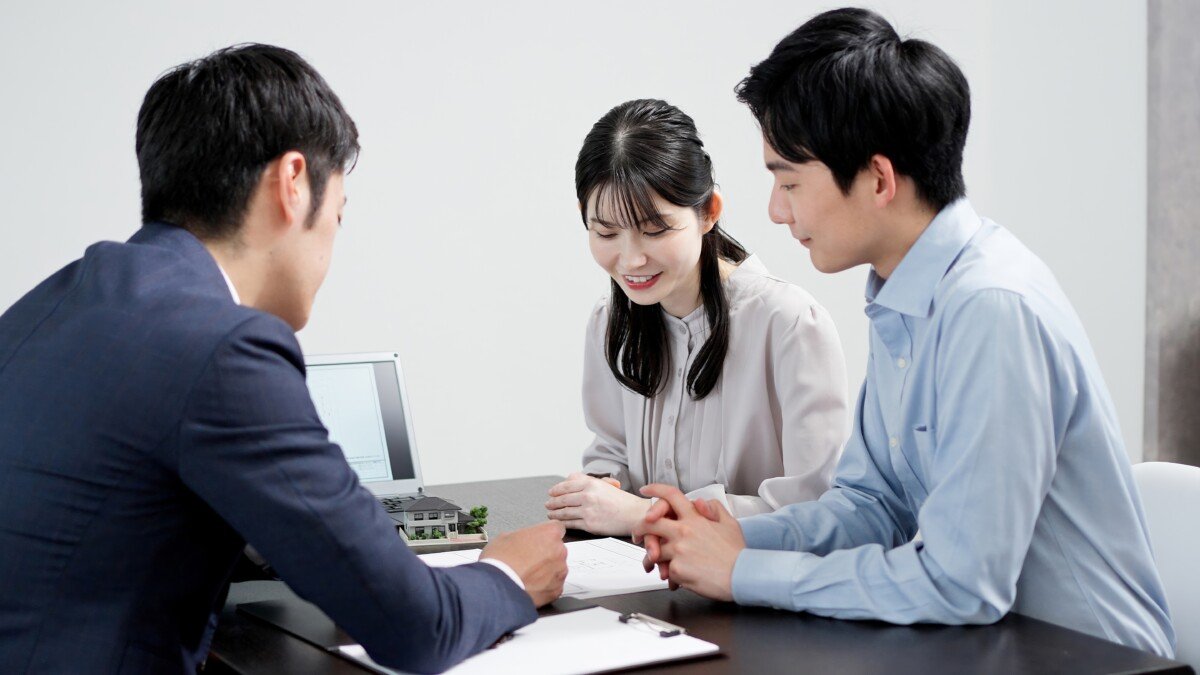 A businessman explaining real estate to a customer