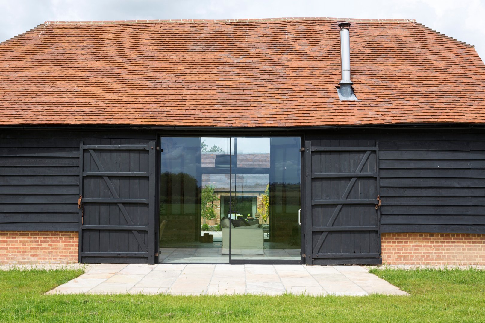 Glass sliding doors of converted barn home