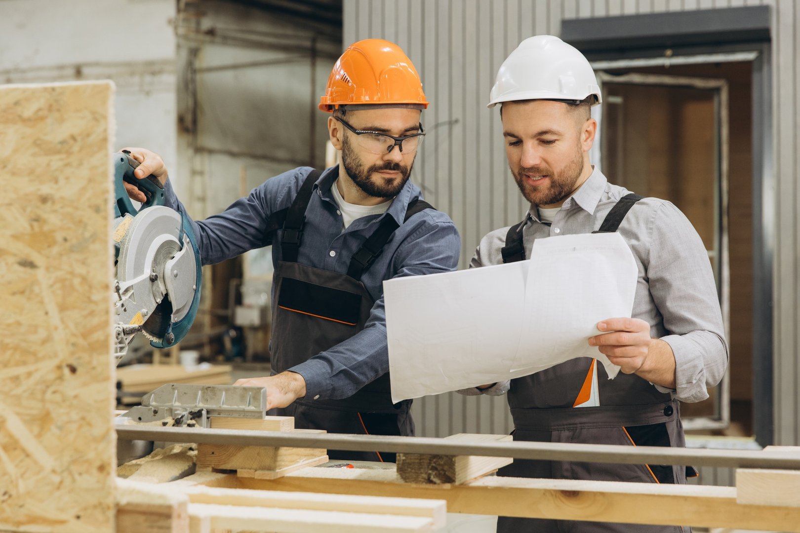 Builders working on modular home construction project
