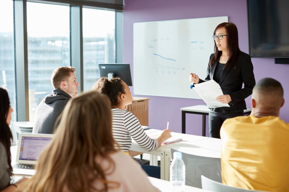 University lecturer and students in class