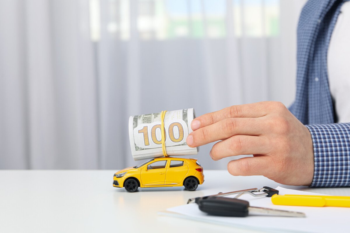 Concept of car purchase and insurance with toy car