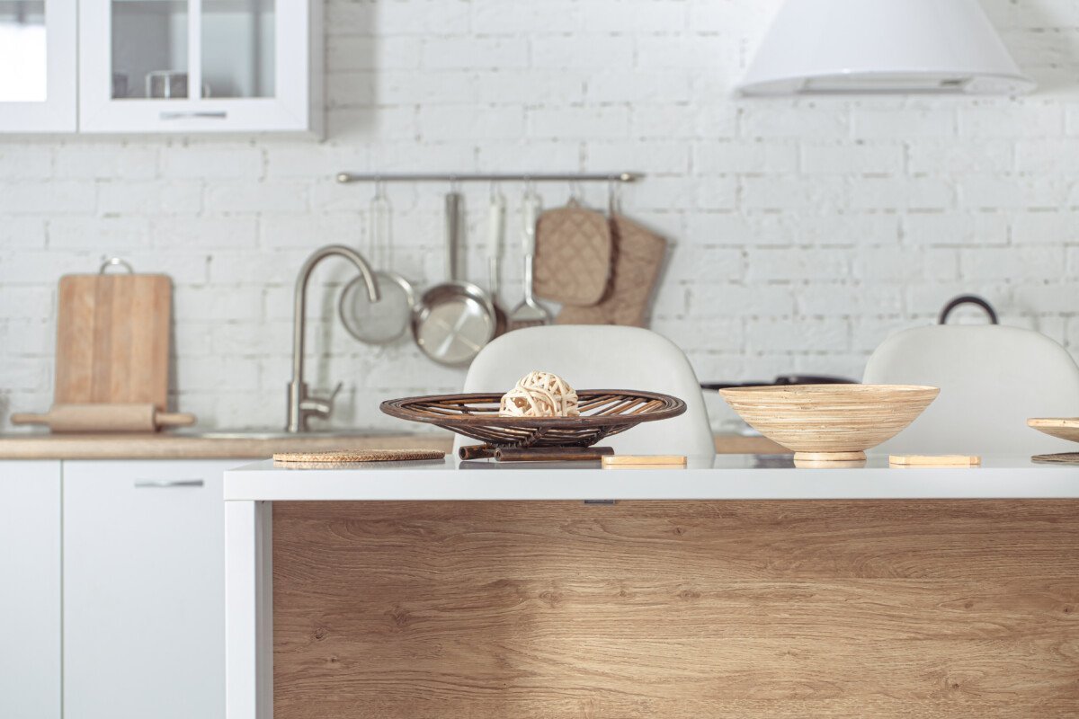 Modern stylish Scandinavian kitchen interior with kitchen accessories. Bright white kitchen with household items .